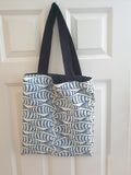 Handmade tote bag with blue sprats fish print and navy cotton handles