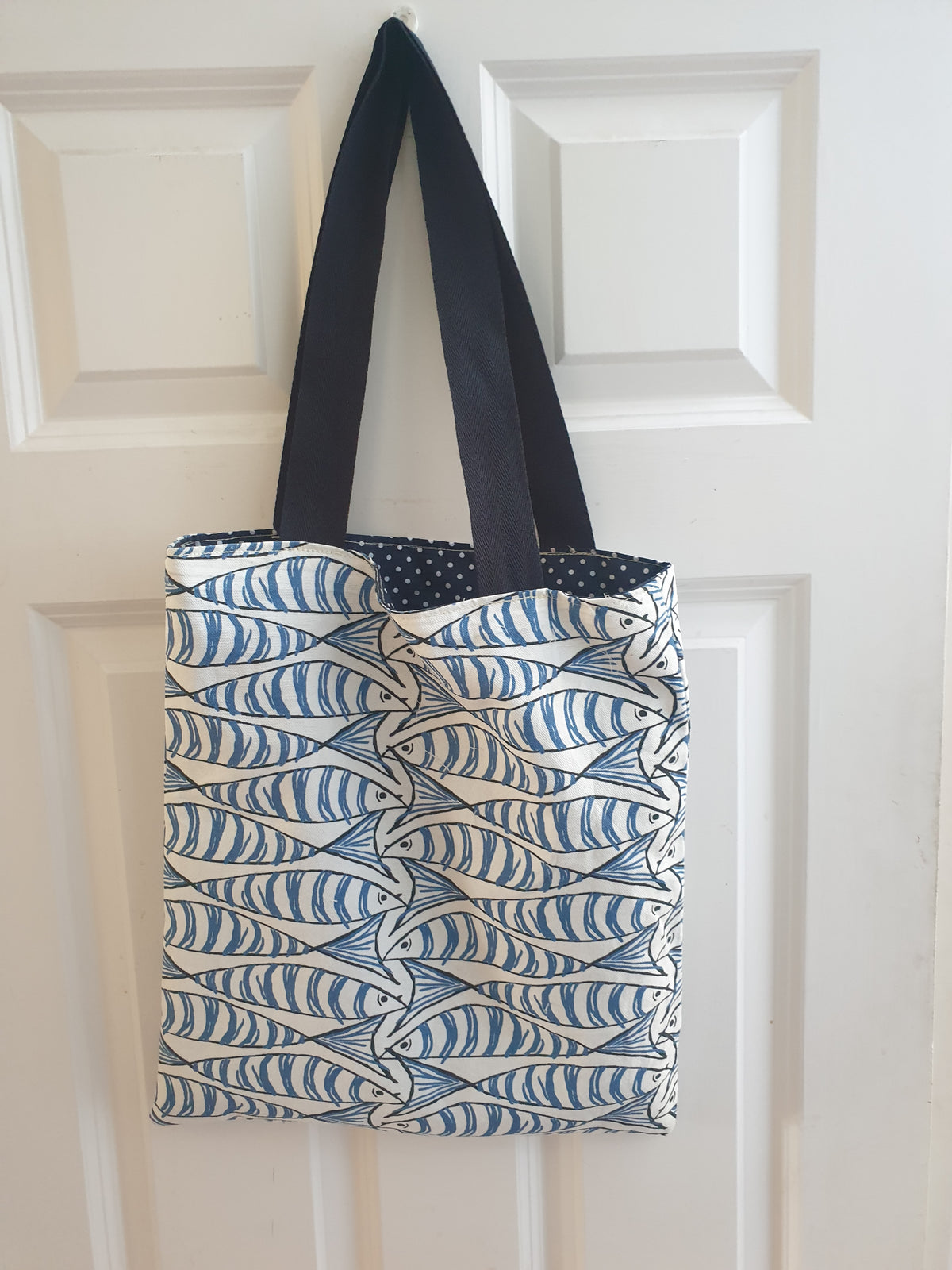 Handmade tote bag with blue sprats fish print and navy cotton handles