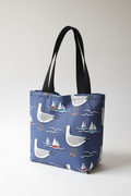 Navy blue seagulls and sailing boats tote bag