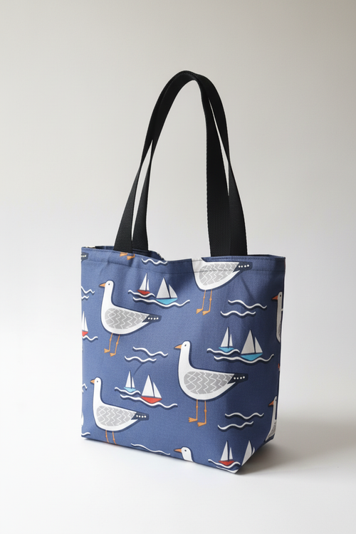 Navy blue seagulls and sailing boats tote bag
